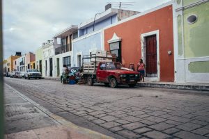 a red truck parked on the side of the road