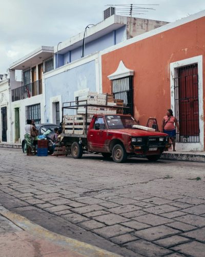 a red truck parked on the side of the road