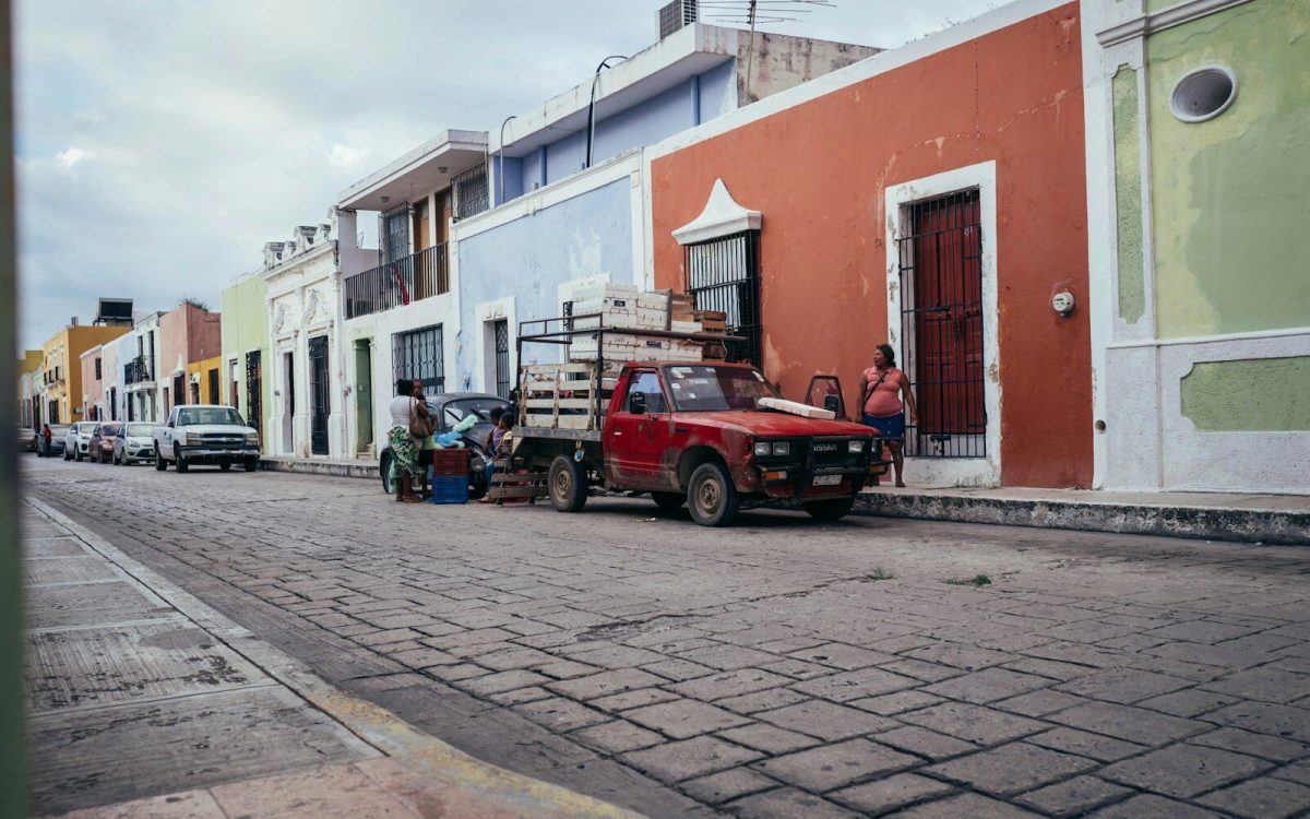 a red truck parked on the side of the road